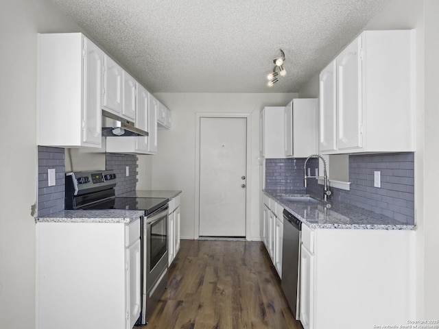 kitchen featuring white cabinetry, sink, stainless steel appliances, and a textured ceiling