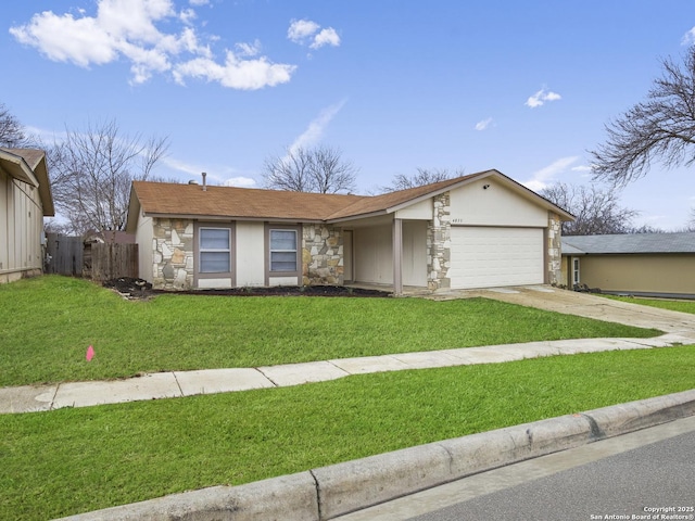 ranch-style home featuring a garage and a front lawn