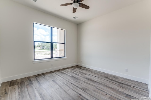 unfurnished room featuring ceiling fan and light wood-type flooring