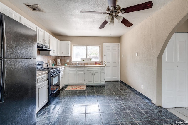 kitchen with decorative backsplash, sink, white cabinets, and black appliances