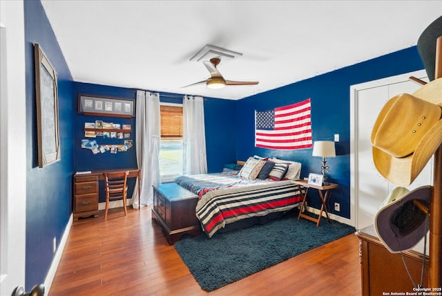 bedroom featuring wood-type flooring and ceiling fan