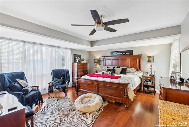 bedroom featuring ceiling fan and dark hardwood / wood-style flooring