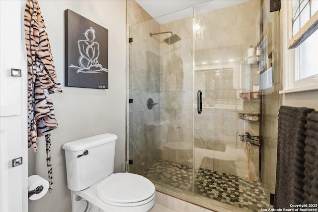 bathroom with walk in shower and toilet