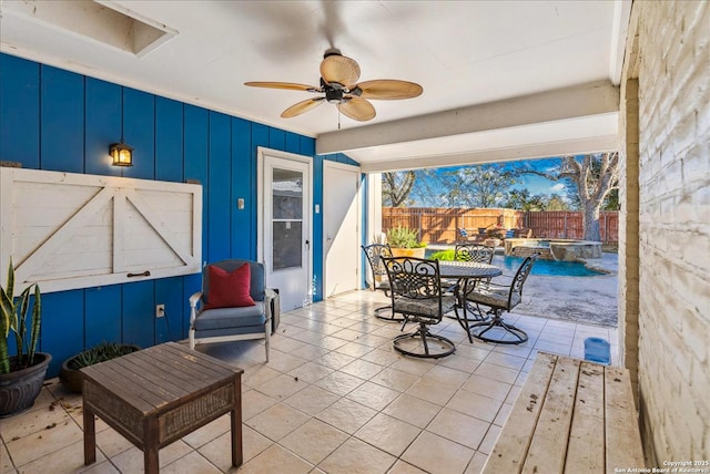 view of patio / terrace featuring a fenced in pool and ceiling fan