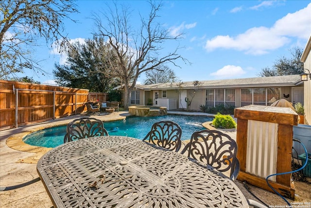 view of pool with a patio and an in ground hot tub