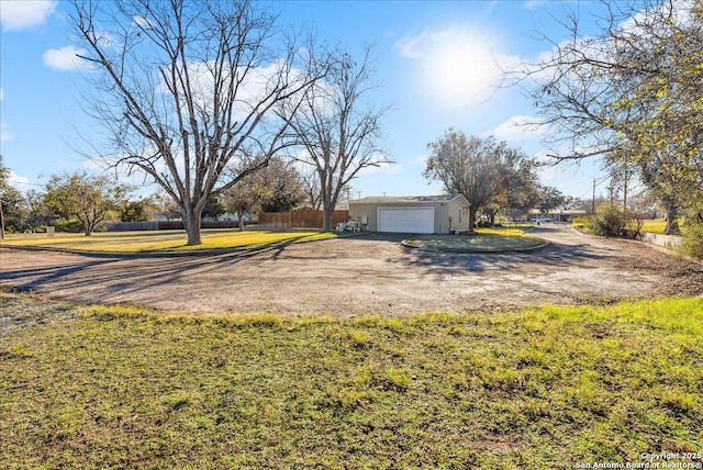 view of yard featuring a garage