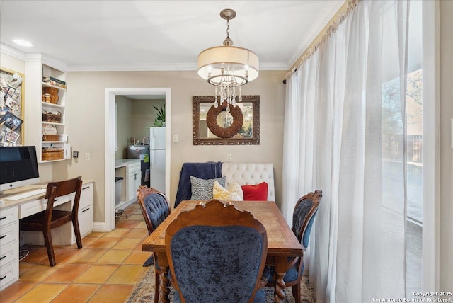 dining room featuring an inviting chandelier, ornamental molding, and light tile patterned floors