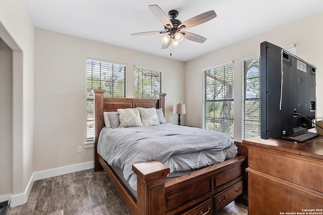 bedroom with dark wood-type flooring and ceiling fan