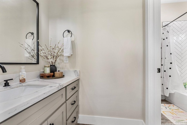 bathroom featuring vanity and shower / tub combo with curtain