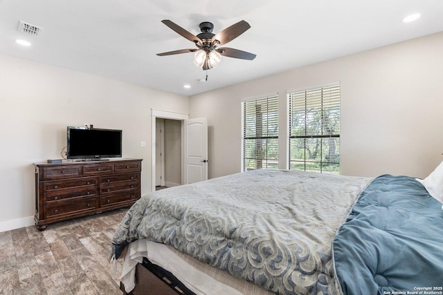 bedroom featuring light wood-type flooring and ceiling fan