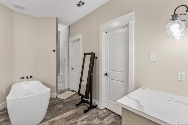 bathroom with wood-type flooring and separate shower and tub