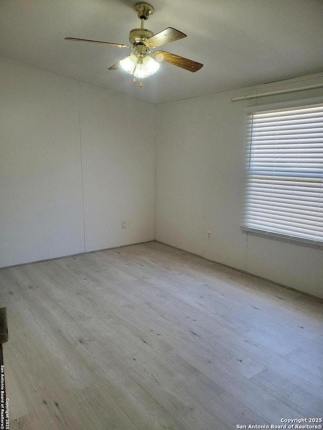 unfurnished room featuring ceiling fan and light hardwood / wood-style floors