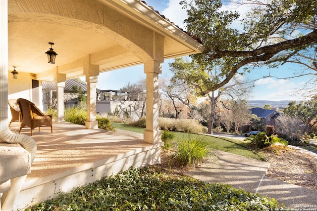 surrounding community featuring a patio