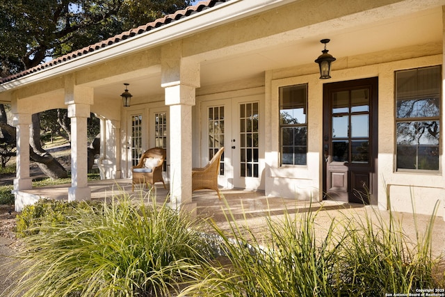 property entrance featuring french doors