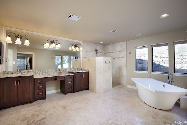 bathroom featuring vanity, plenty of natural light, and independent shower and bath