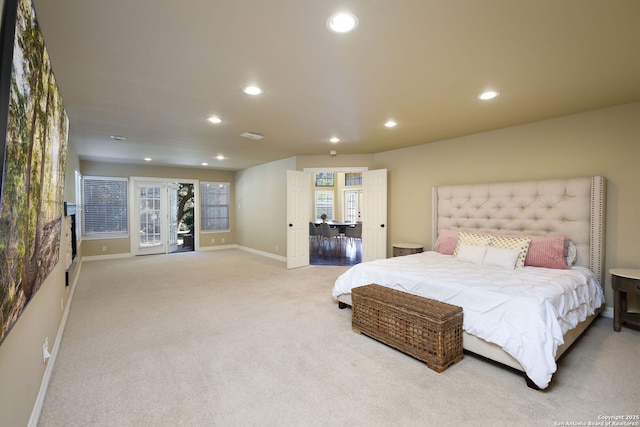 bedroom featuring access to exterior and light carpet