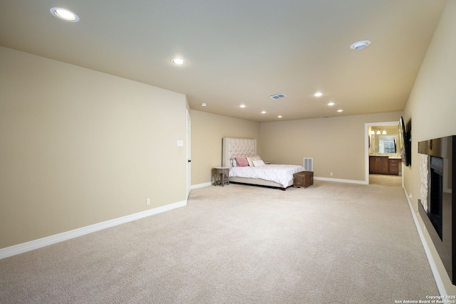 unfurnished bedroom featuring light colored carpet