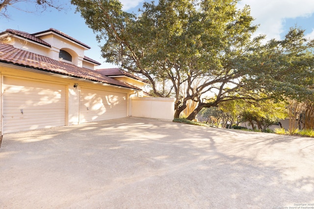 view of property exterior with a garage