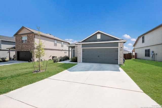 view of front of home featuring a garage and a front lawn