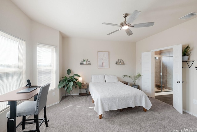 carpeted bedroom featuring multiple windows and ceiling fan