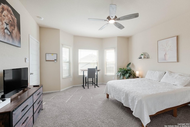 bedroom featuring light carpet and ceiling fan