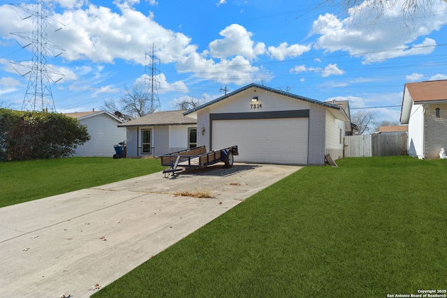 ranch-style house with a garage and a front lawn