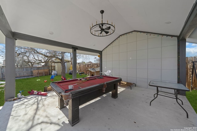 game room featuring concrete flooring and lofted ceiling