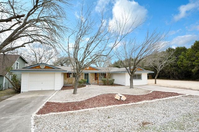 ranch-style house featuring a garage