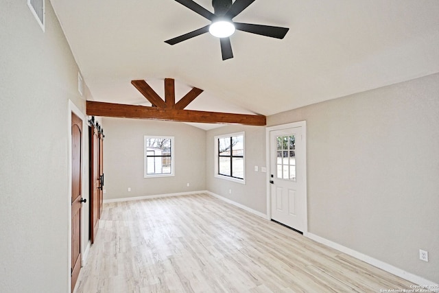 interior space featuring lofted ceiling, ceiling fan, and light hardwood / wood-style flooring