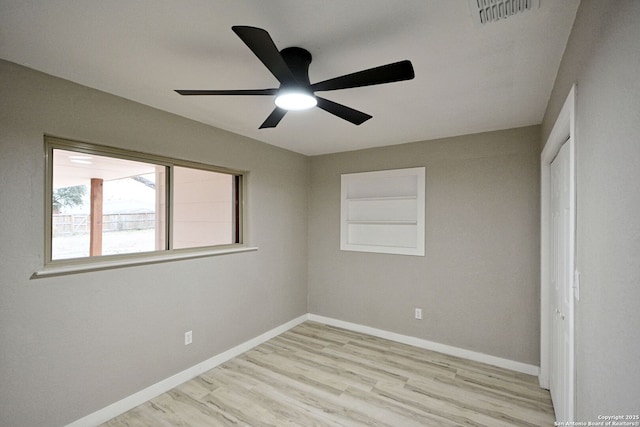 unfurnished bedroom featuring ceiling fan, a closet, and light wood-type flooring