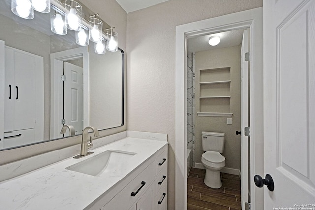 bathroom with vanity and toilet