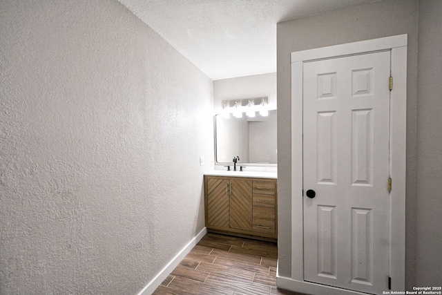 bathroom featuring vanity and a textured ceiling