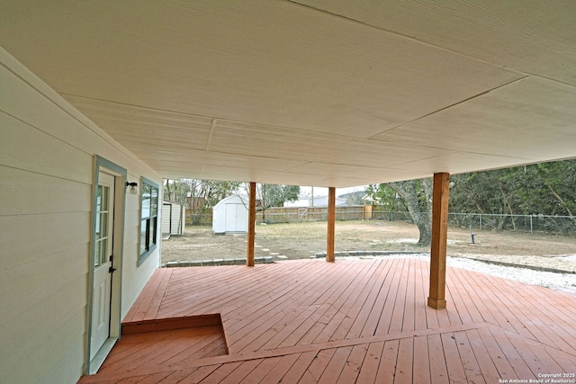 wooden deck with a shed