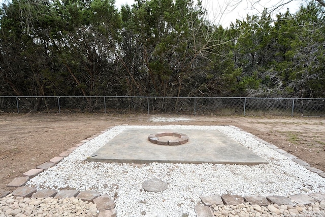 view of yard featuring a patio and a fire pit