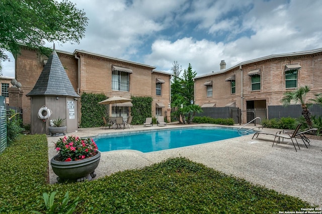 view of pool featuring a patio