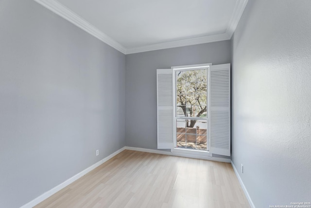 unfurnished room with ornamental molding and light hardwood / wood-style floors