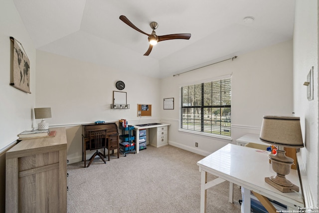 home office featuring ceiling fan, light colored carpet, and vaulted ceiling