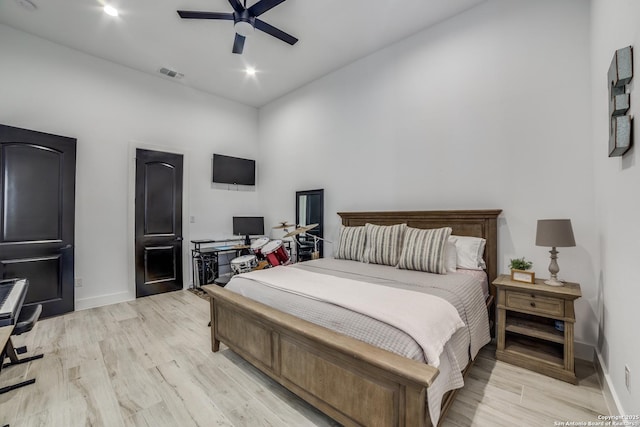 bedroom featuring ceiling fan and light hardwood / wood-style flooring