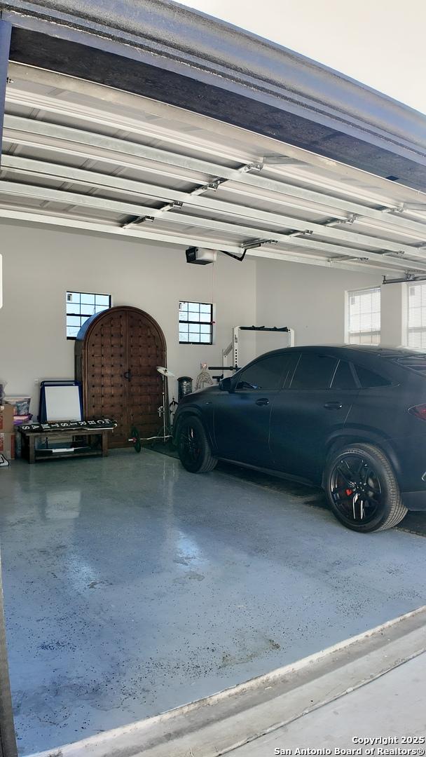 garage featuring a garage door opener