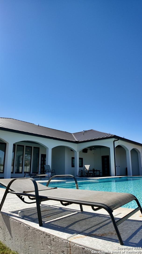 view of swimming pool with a patio area