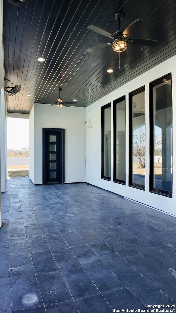 view of patio with ceiling fan