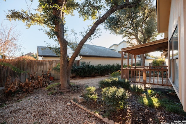 view of yard with a wooden deck