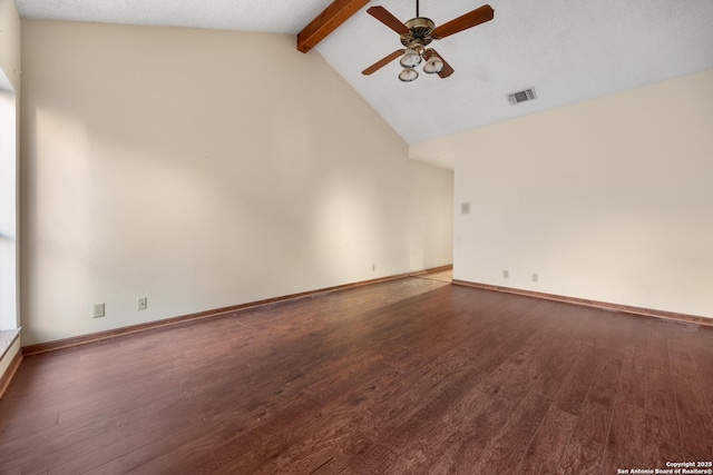 spare room with vaulted ceiling with beams, dark wood-type flooring, and ceiling fan