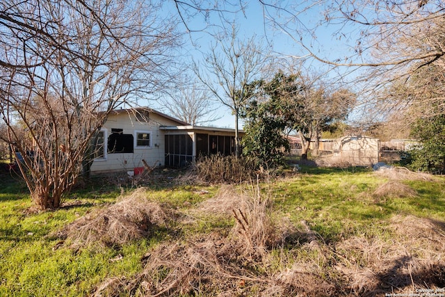 view of yard featuring a sunroom