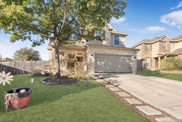 view of front of house with a garage and a front lawn