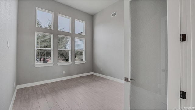 unfurnished room featuring light wood-type flooring