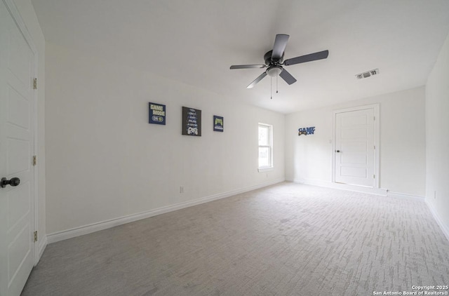 carpeted empty room with ceiling fan