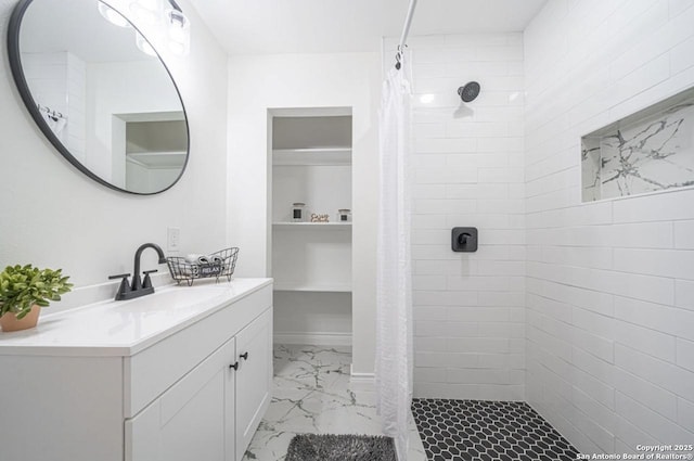 bathroom featuring vanity and curtained shower