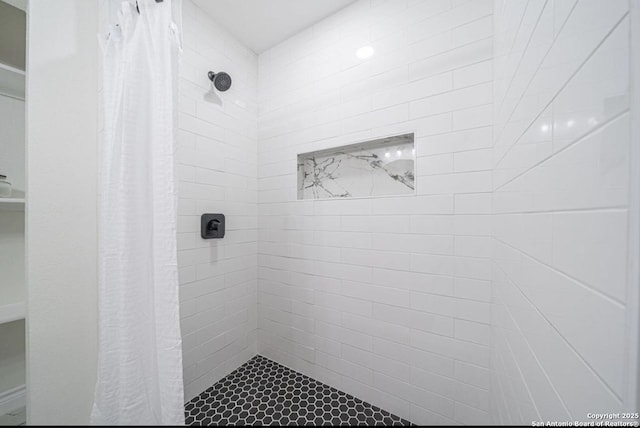 bathroom with a shower with shower curtain