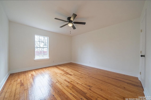 empty room with ceiling fan and light wood-type flooring